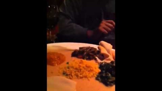 'Sareena eating Ethiopian food'