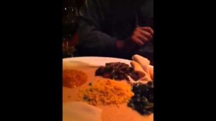 'Sareena eating Ethiopian food'