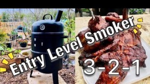 'Smoking Ribs: How I smoke meat on a budget upright smoker'