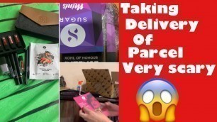 'Taking the delivery of the parcel from SUGAR COSMETICS'